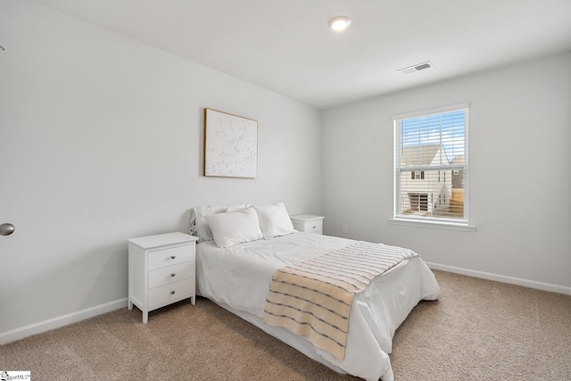 bedroom with light carpet