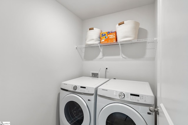 laundry area featuring washing machine and clothes dryer