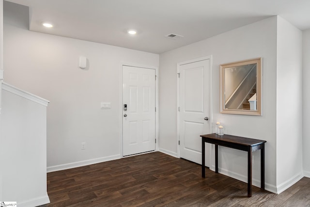 foyer entrance featuring dark hardwood / wood-style floors