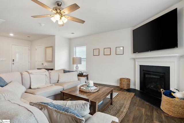 living room with dark hardwood / wood-style floors and ceiling fan