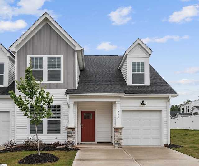 view of front of property featuring a garage and a front yard