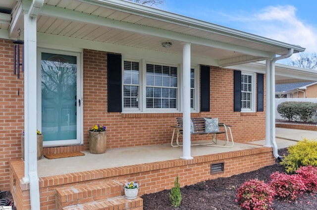 doorway to property featuring a porch