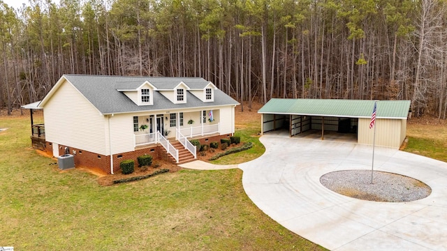 view of front of home featuring cooling unit, a carport, covered porch, and a front yard