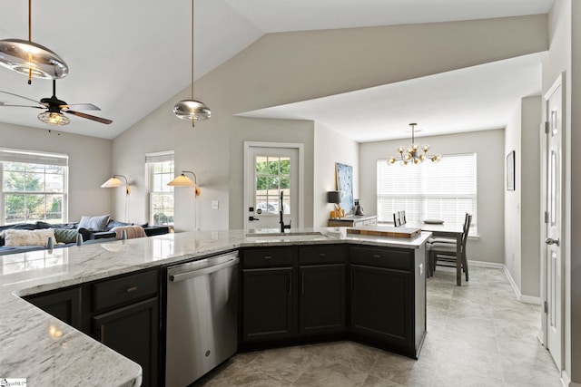 kitchen featuring sink, plenty of natural light, light stone countertops, and dishwasher