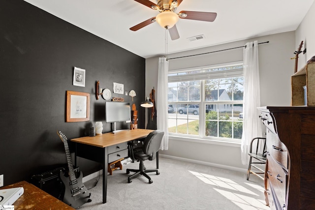 carpeted office with ceiling fan