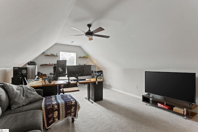 carpeted office featuring vaulted ceiling and ceiling fan