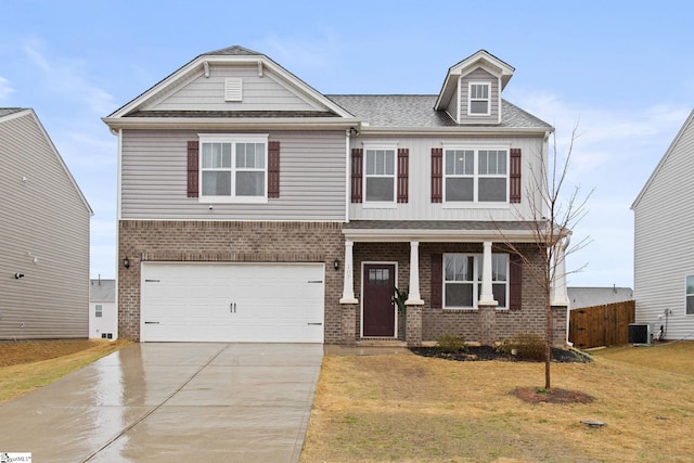 craftsman house featuring a garage, a front lawn, and central air condition unit