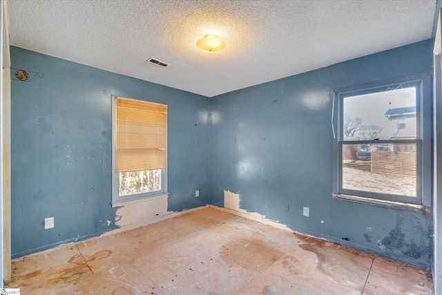 empty room with a textured ceiling