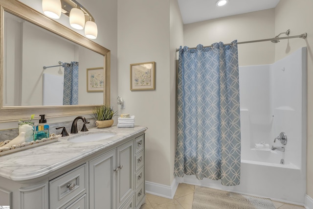 bathroom with shower / bath combination with curtain, vanity, and tile patterned floors