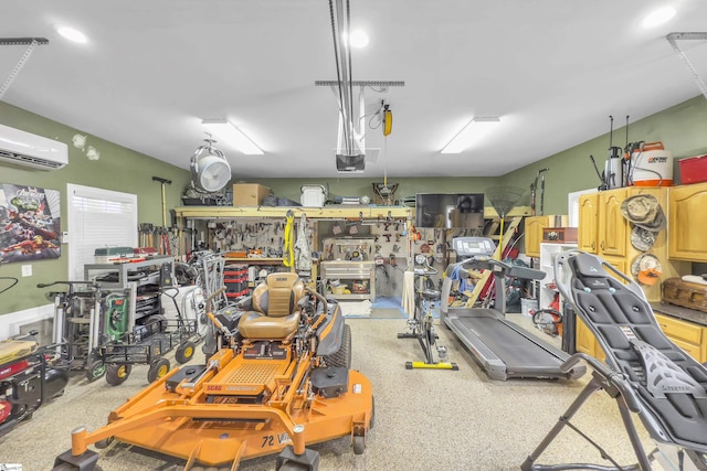 garage with a wall mounted AC and a workshop area