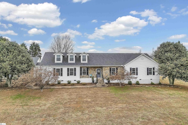 cape cod home with a front lawn