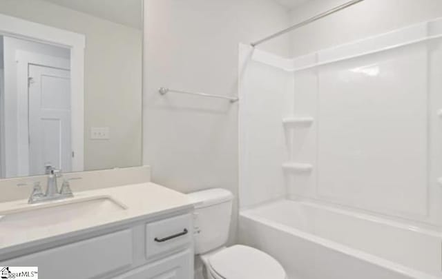 full bathroom with vanity, bathing tub / shower combination, and toilet