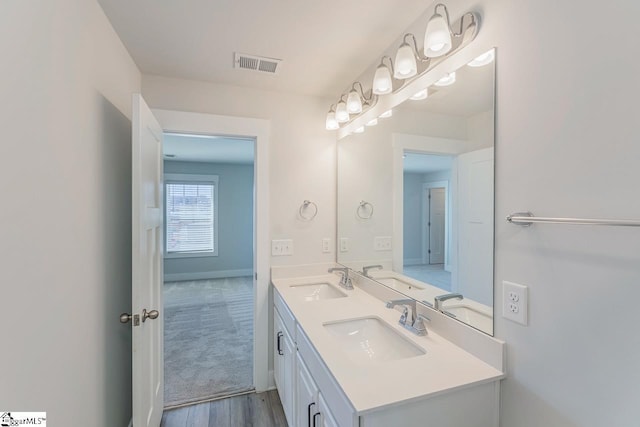 bathroom featuring vanity and hardwood / wood-style floors