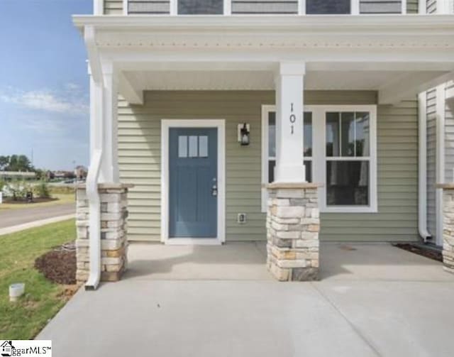 property entrance featuring covered porch