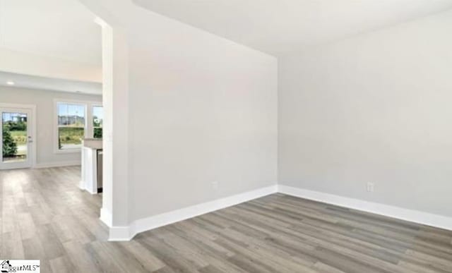 spare room with light wood-type flooring