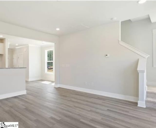 unfurnished living room featuring light wood-type flooring