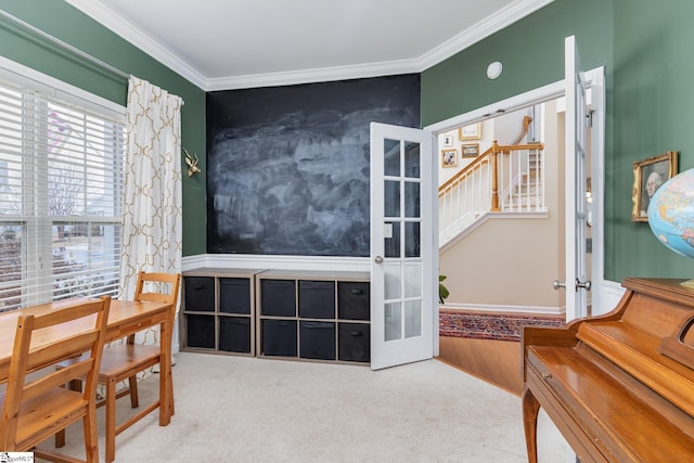 interior space with crown molding, french doors, and carpet flooring