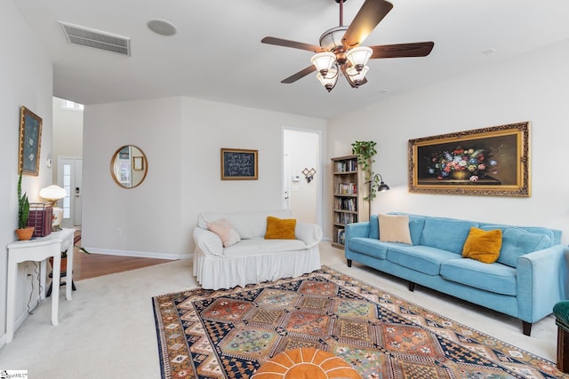 living room featuring ceiling fan and light carpet