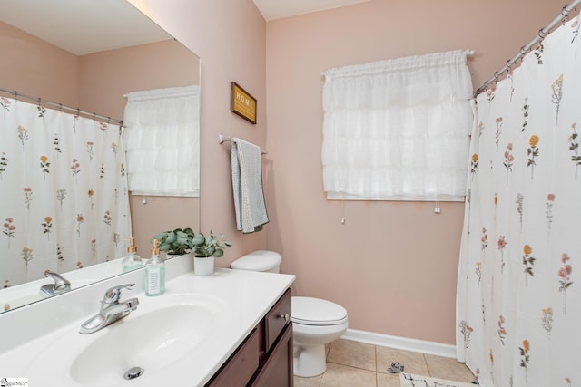 bathroom with vanity, tile patterned floors, and toilet