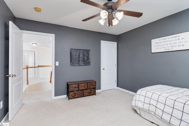 bedroom featuring light carpet and ceiling fan