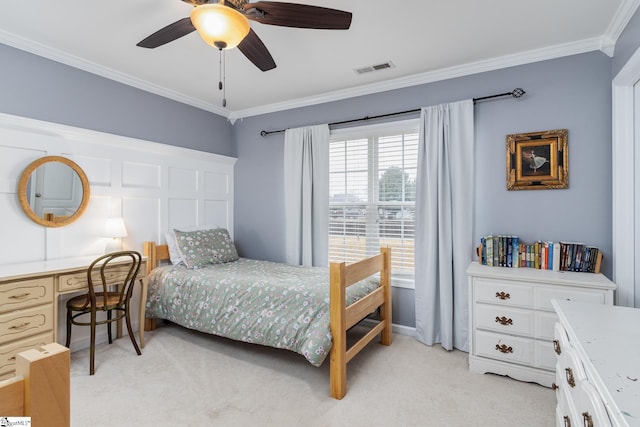 bedroom featuring crown molding, light carpet, ceiling fan, and built in desk