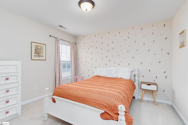 bedroom with light colored carpet