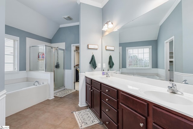 bathroom with shower with separate bathtub, lofted ceiling, a wealth of natural light, and vanity