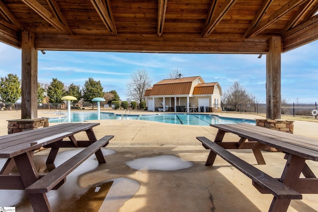 view of swimming pool featuring a patio area