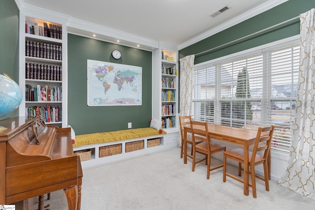 interior space featuring ornamental molding, carpet flooring, and built in shelves