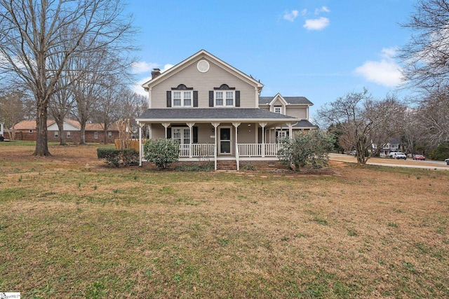 view of front facade with a front lawn and a porch