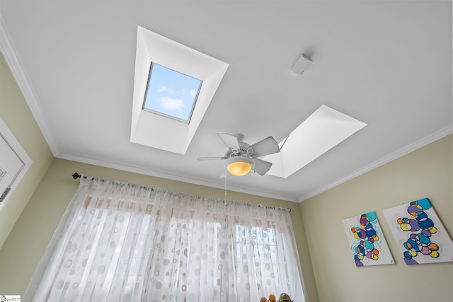 details with crown molding, ceiling fan, and a skylight