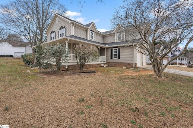 view of front of house with a front yard and covered porch