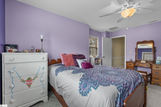 bedroom with light carpet and ceiling fan