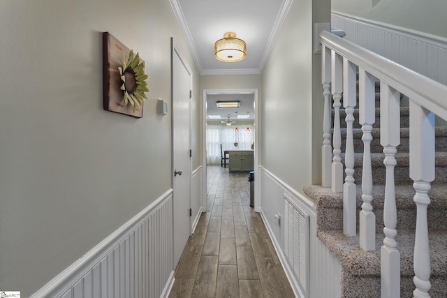 hallway featuring crown molding