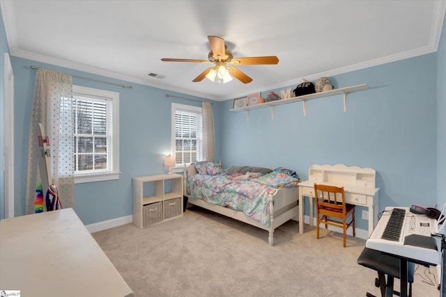 bedroom with ornamental molding, light colored carpet, and ceiling fan