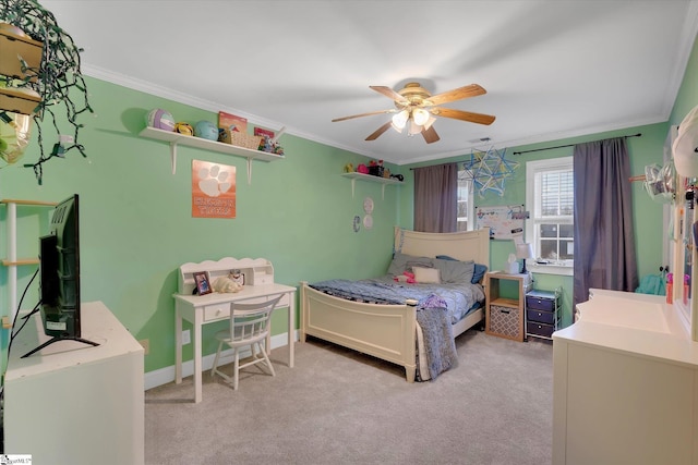 bedroom featuring crown molding, light colored carpet, and ceiling fan