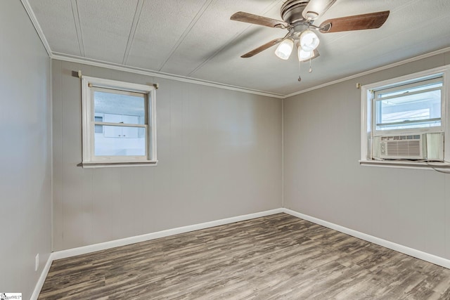 unfurnished room with a textured ceiling, wood-type flooring, ornamental molding, and ceiling fan