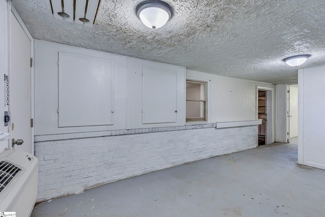 interior space featuring a textured ceiling