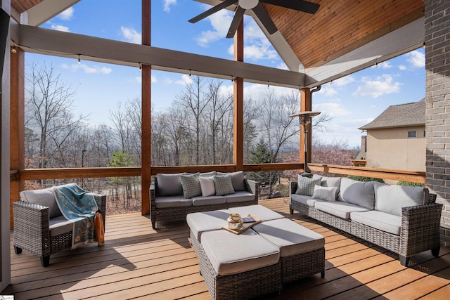 wooden deck featuring ceiling fan and lofted ceiling