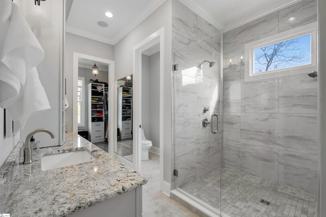 bathroom with ornamental molding, toilet, an enclosed shower, and vanity