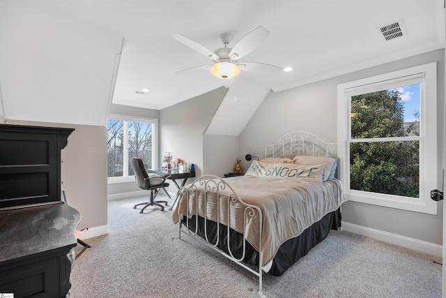 carpeted bedroom featuring ceiling fan, lofted ceiling, and ornamental molding