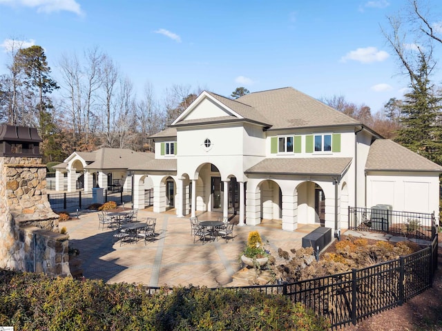 back of house featuring a patio area