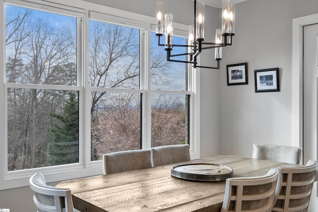 dining area featuring a wealth of natural light and a chandelier