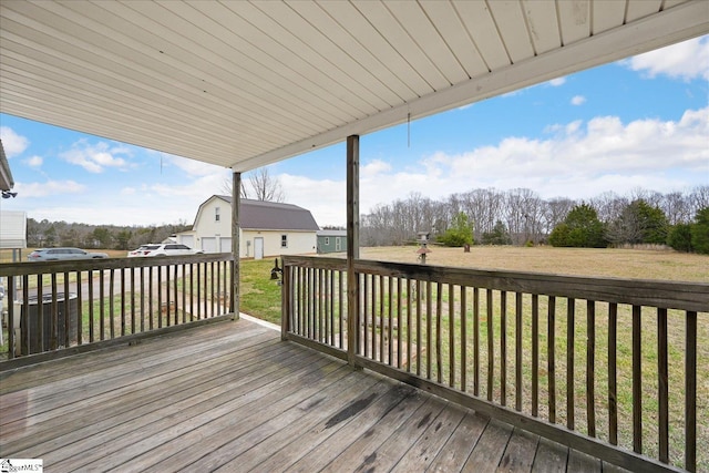 wooden deck with a lawn