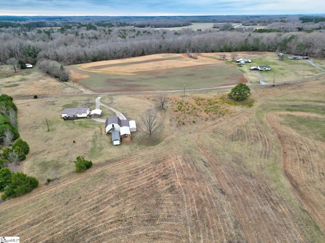 birds eye view of property with a rural view