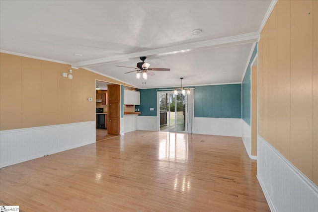 spare room featuring vaulted ceiling with beams, ceiling fan with notable chandelier, light hardwood / wood-style flooring, and ornamental molding