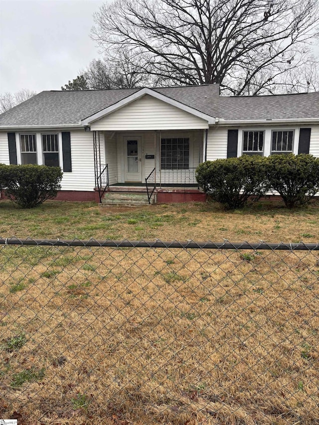 single story home with a porch and a front yard