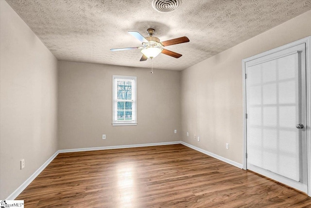 unfurnished room featuring hardwood / wood-style floors, a textured ceiling, and ceiling fan