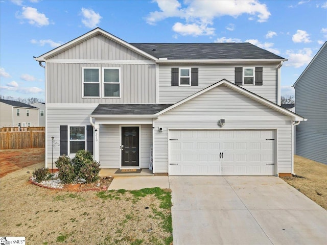 view of front property with a garage and a front yard