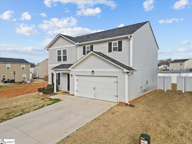 view of front property with a garage and a front yard